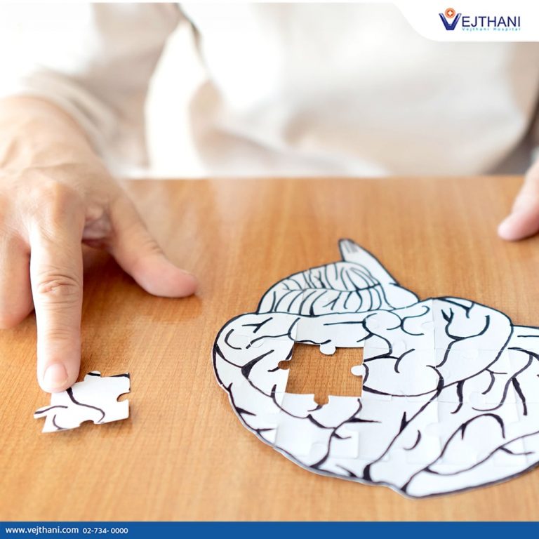 A stroke rehabilitation patient in Thailand completes a puzzle to regain fine motor coordination.